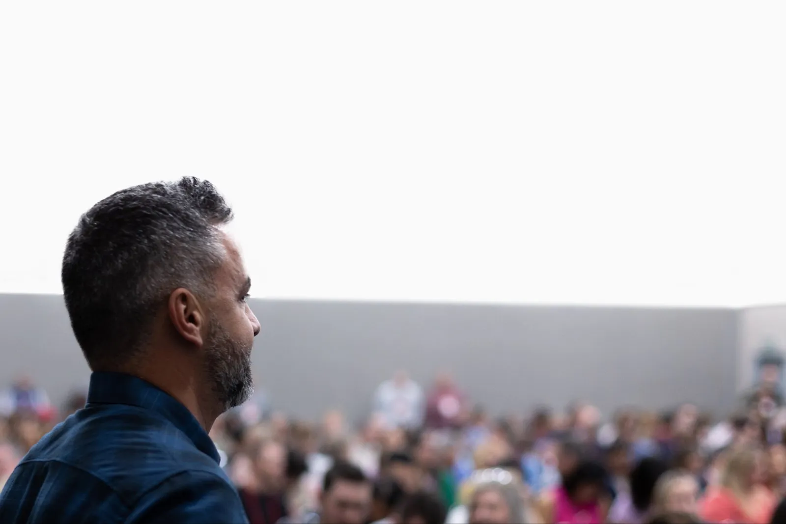 Brett Tanner speaking to a large audience