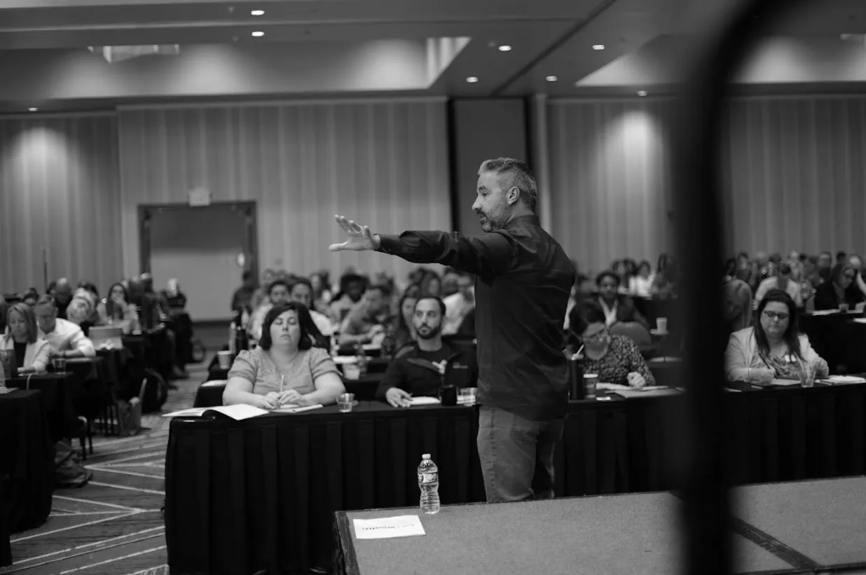 Brett Tanner coaching on stage
