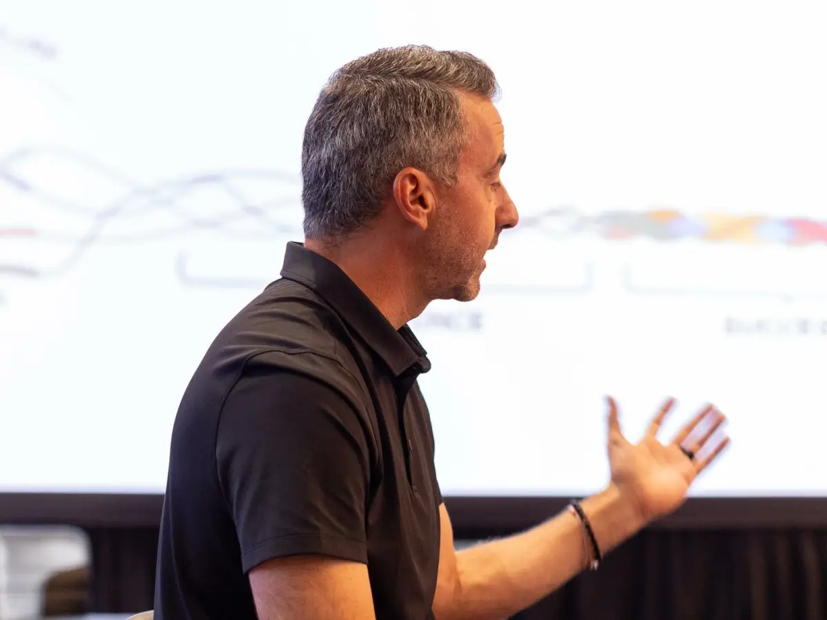Brett Tanner coaching a client through their numbers