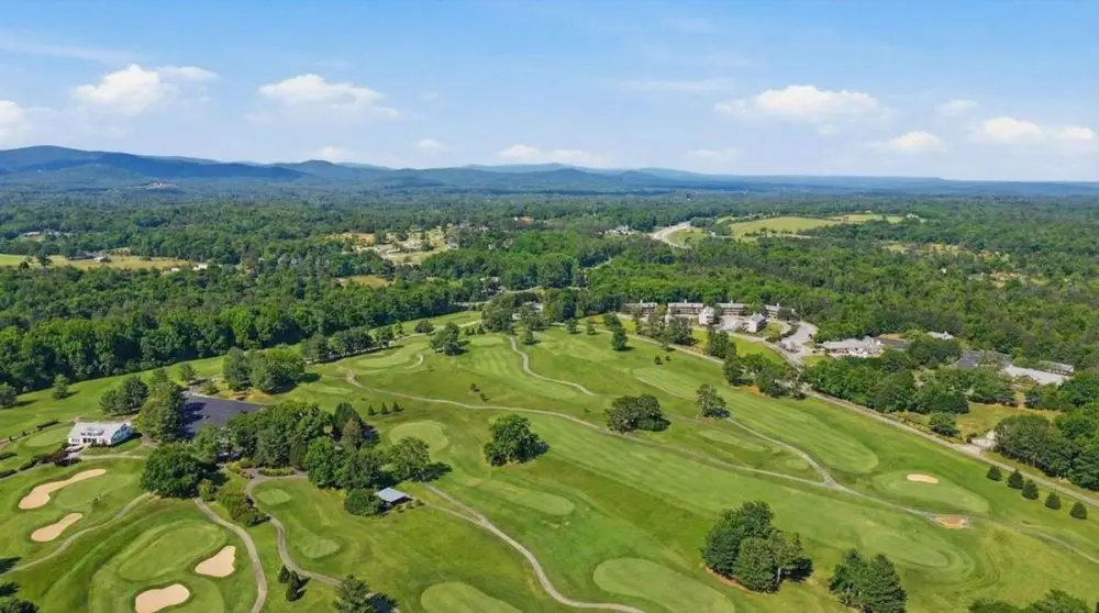 Wide aerial of Apple Mountain with the north Georgia mountains behind it