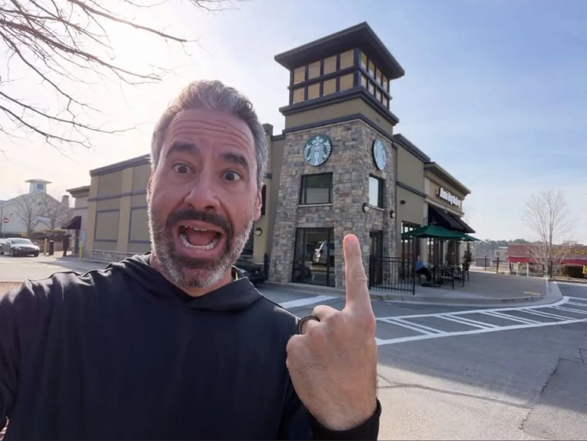 Brett Tanner in front of a Starbucks-anchored building he owns