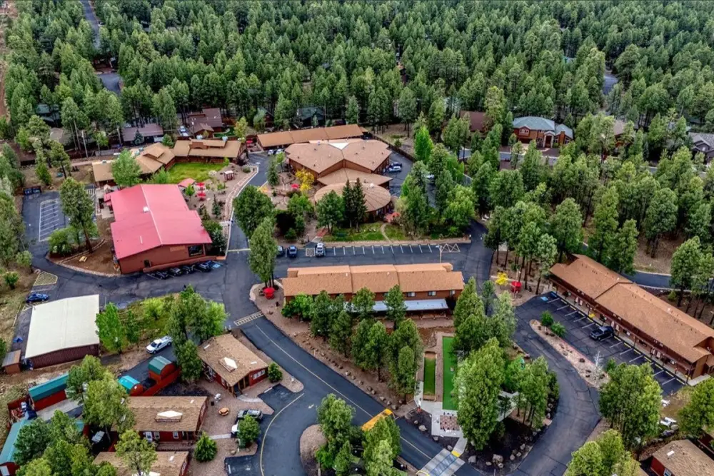 Aerial view of Roundhouse Resort set in the pines in Pinetop, Arizona