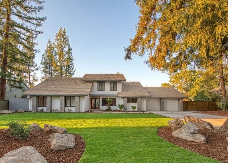 Front of the house after, modern exterior with fresh landscaping