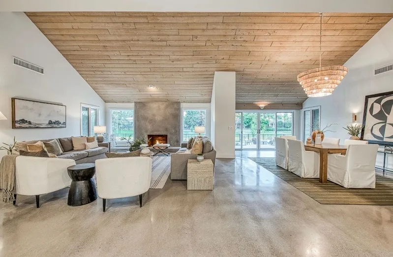 Living room after, staged with polished floors and designer furniture